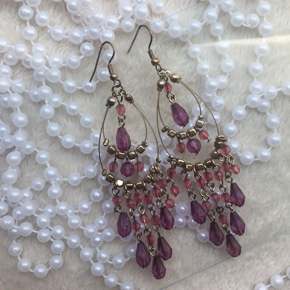 Yellow 💛gold earrings with a 💜purple diamonds